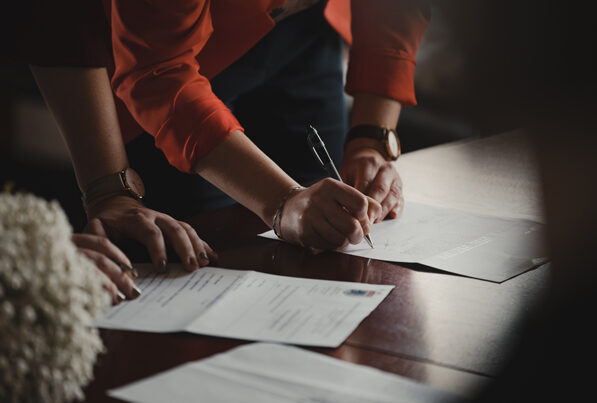 Woman and man signing a contract